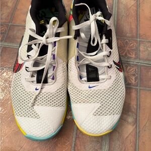 Nike White and Black Athletic Shoes with Yellow Accents